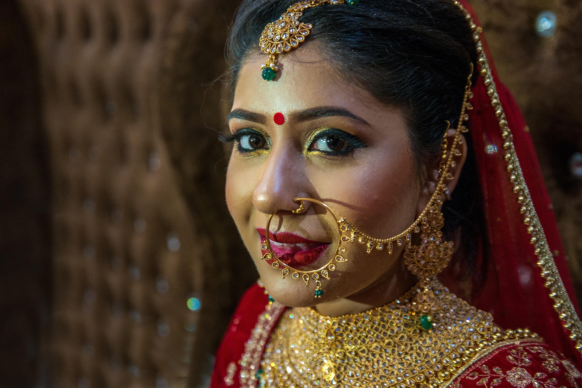 Groom applying sindoor during wedding ceremony