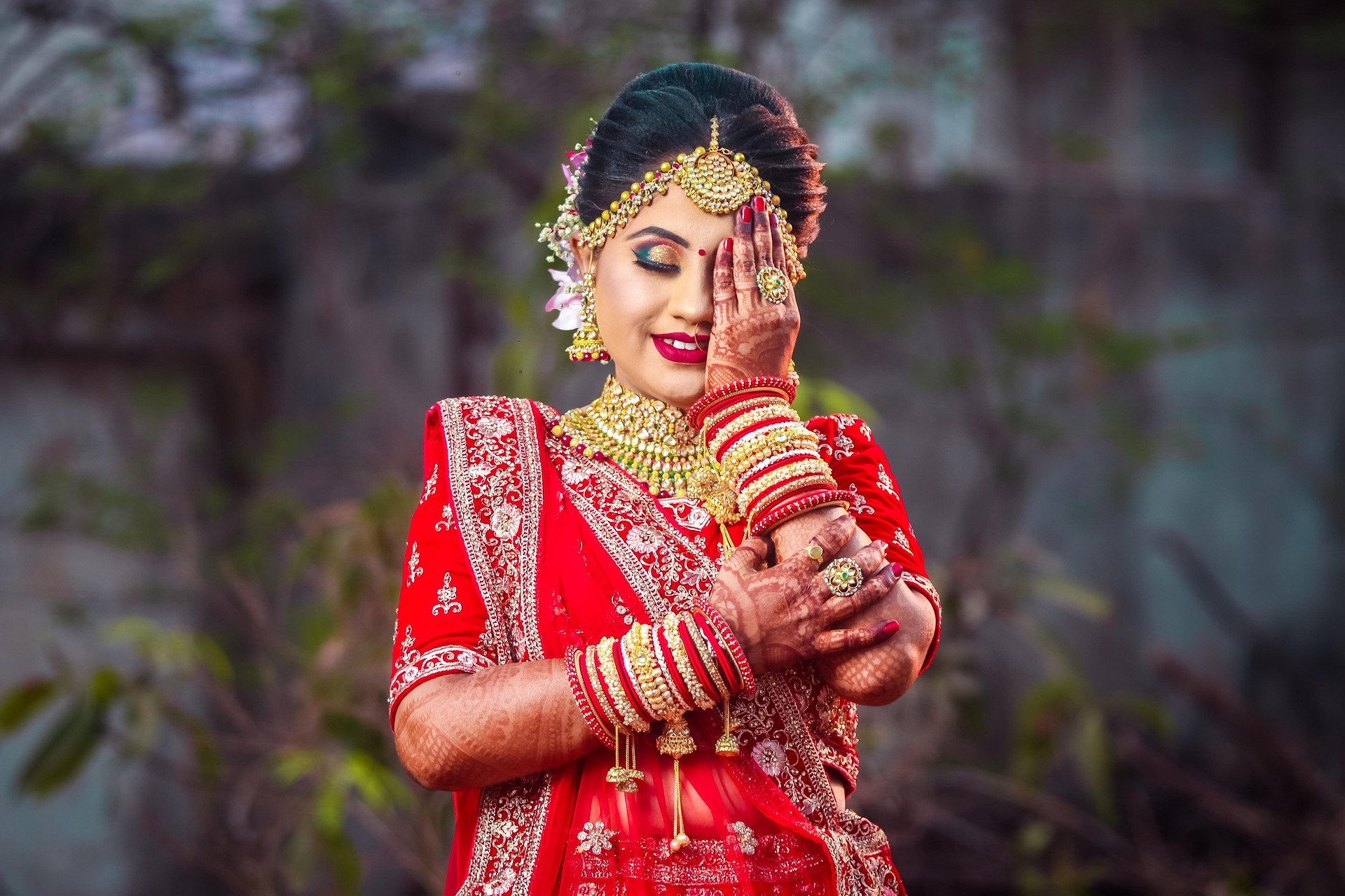 Groom applying sindoor during wedding ceremony